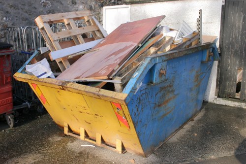 Rubbish clearance team unloading waste