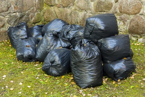 Rubbish collection trucks in Hither Green