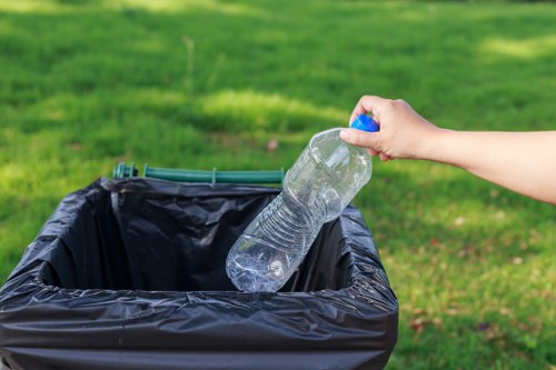 Resident sorting waste for recycling in Hither Green